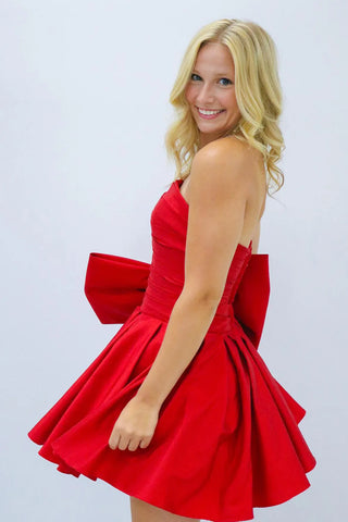 A-Linien-Partykleid ohne Träger und mit Plissee und Schleife