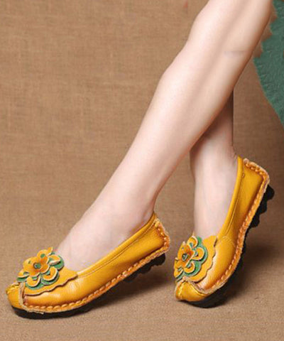 Boutique Gelbe flache Schuhe aus Rindsleder mit Blumenmuster