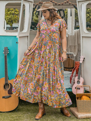 Große Größen - Maxikleid mit Rüschen und bedruckten Flügelärmeln