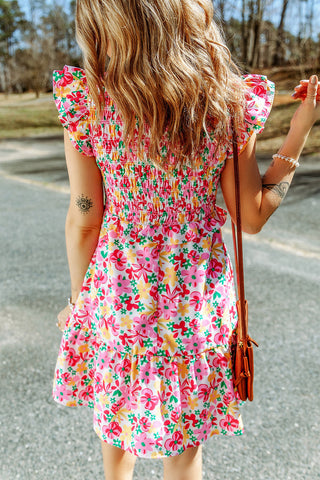 Gesmoktes Kleid mit floralem Rüschenbesatz