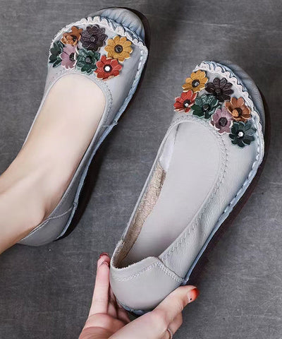 Einzigartige schwarze flache Schuhe mit Blumenmuster